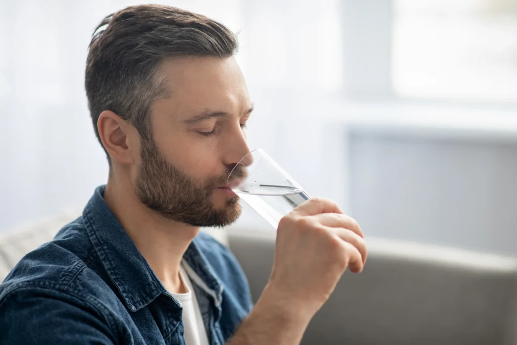 A man drinking water