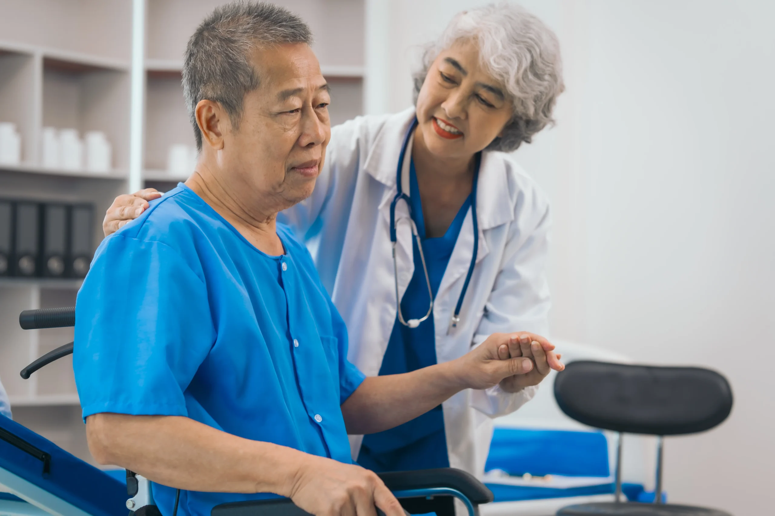 asian-people-mature-woman-doctor-giving-male-elder-2025-03-09-10-14-47-utc