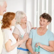 Elderly people laughing together, showing that Laughter – Best Medicine at Home improves health, happiness, and emotional well-being.