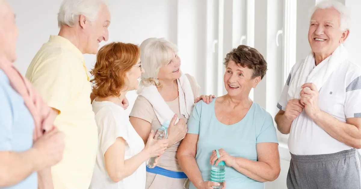 Elderly people laughing together, showing that Laughter – Best Medicine at Home improves health, happiness, and emotional well-being.