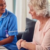 Nurse taking care of Elderly Woman