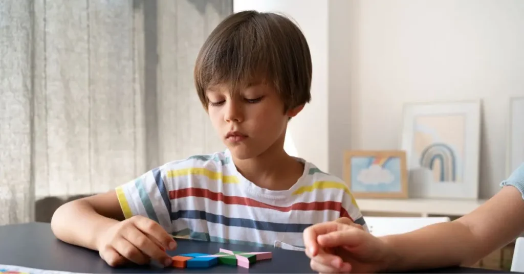 A home nurse is helping an autistic kid with activities