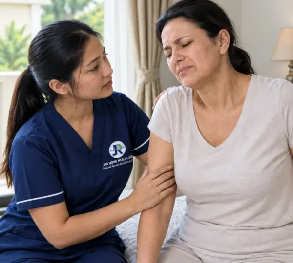 A professional nurse is taking care of a woman with severe disc issues at her home in Sharjah